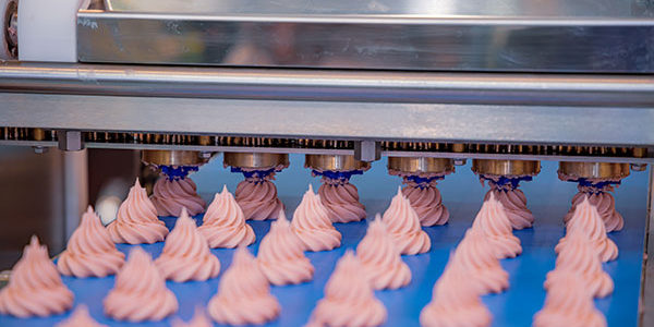 cakes on a conveyor belt