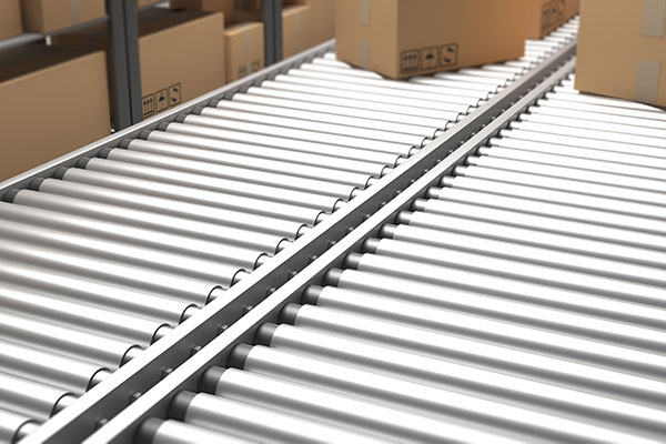 Two side-by-side rolling conveyor lines with boxes on each.