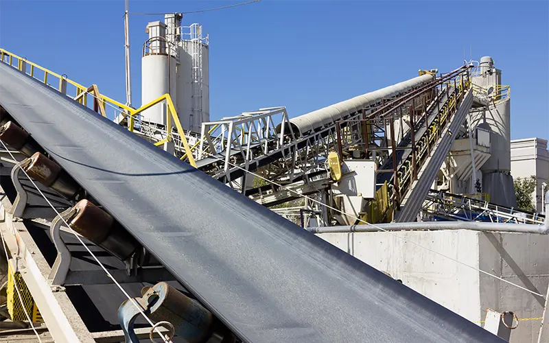 Multiple conveyor belts are used at a processing site.