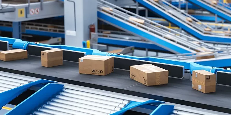 Recyclable Cardboard Box Being Transported on a Conveyor Belt in a Modern Logistics Center. Parcel is Prepared for Delivery to an Online Client. Rendered Conveyor System of a Big Retail Business