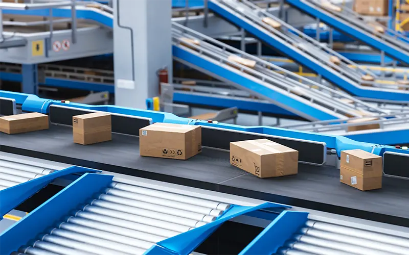 Recyclable Cardboard Box Being Transported on a Conveyor Belt in a Modern Logistics Center. Parcel is Prepared for Delivery to an Online Client. Rendered Conveyor System of a Big Retail Business