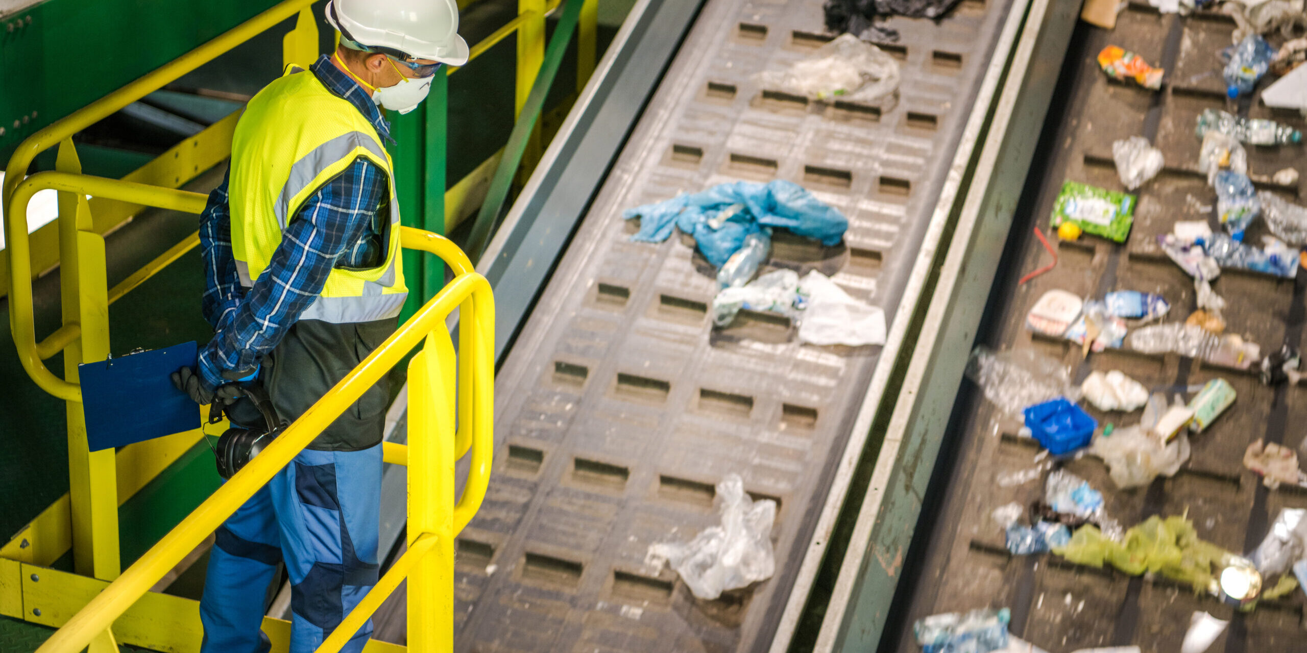 Waste Sorting Facility Management Control. Trash Conveyors Operator Performing Daily Check.